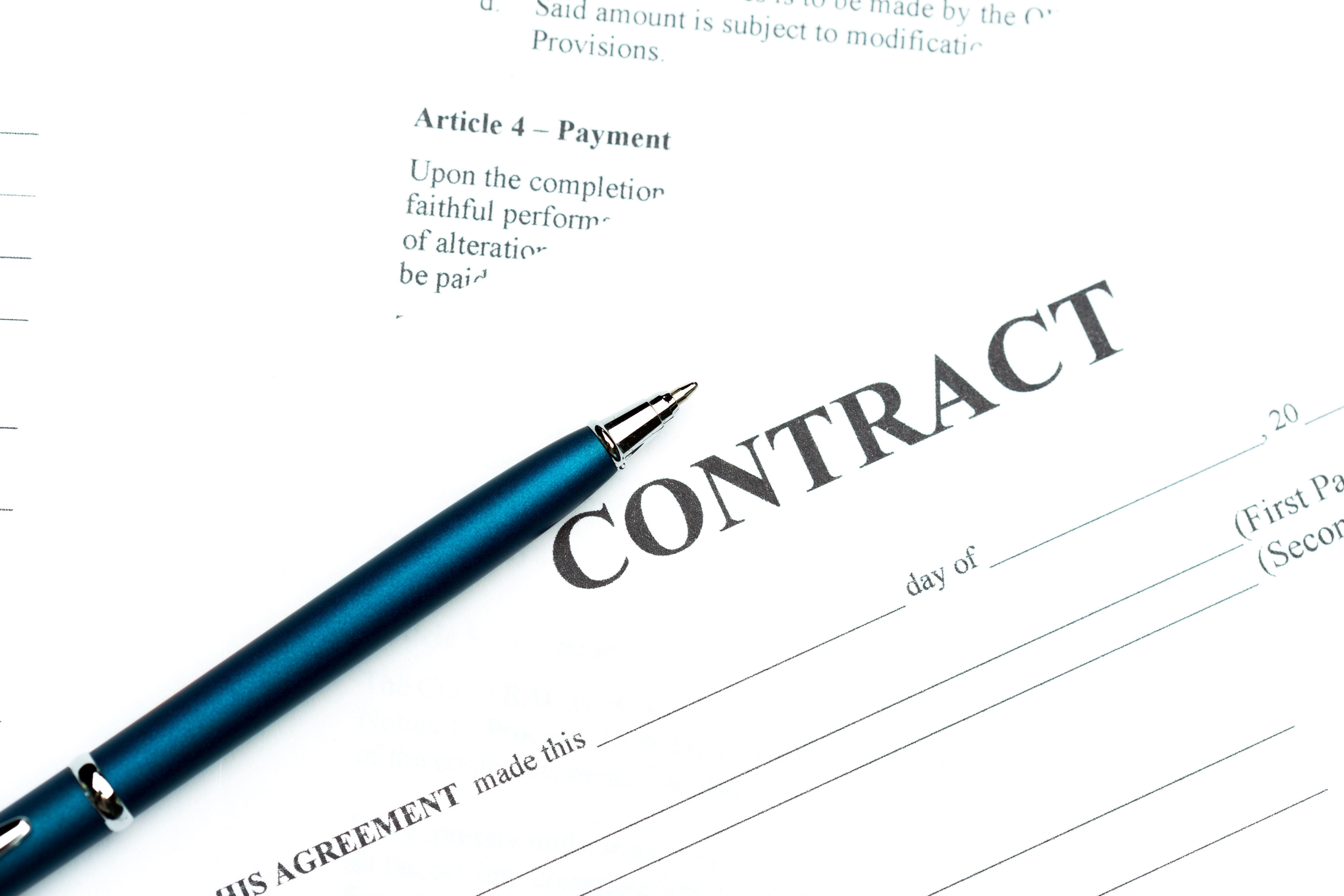 A picture showing a contract paper with a pen